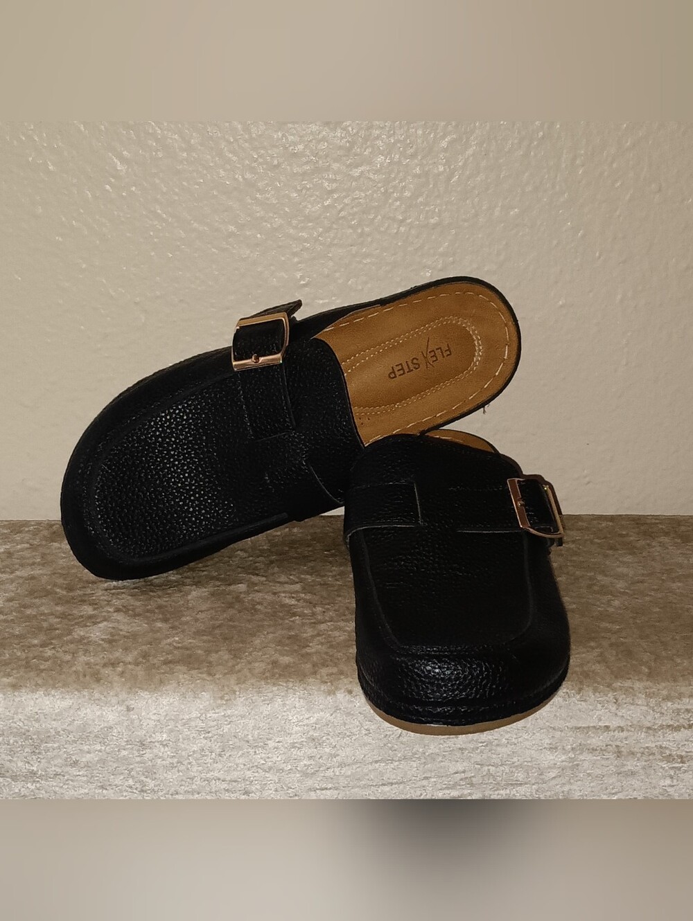 Flex Step Black Slip-On Clogs with Goldtone Adjustable Buckle.